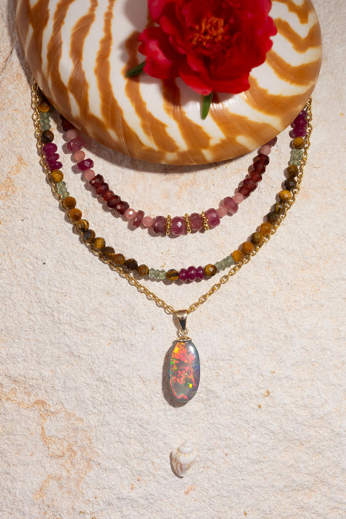 An Australian outback sunset in an opal stone, with all the true colours of black Opal, red, orange, gold and green. This stunning opal pendant is a truly special and unique piece.