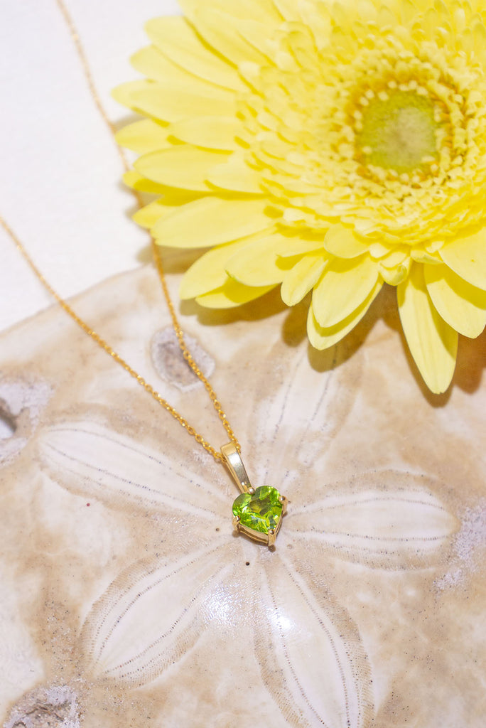 The pendant and chain are 9ct gold vermeil on a base of 925 silver, the gold is 2.5microns thick so will never rub or discolor A round Peridot gemstone set in 9ct gold vermeil. Topaz, Amethyst and Peridot gemstones.