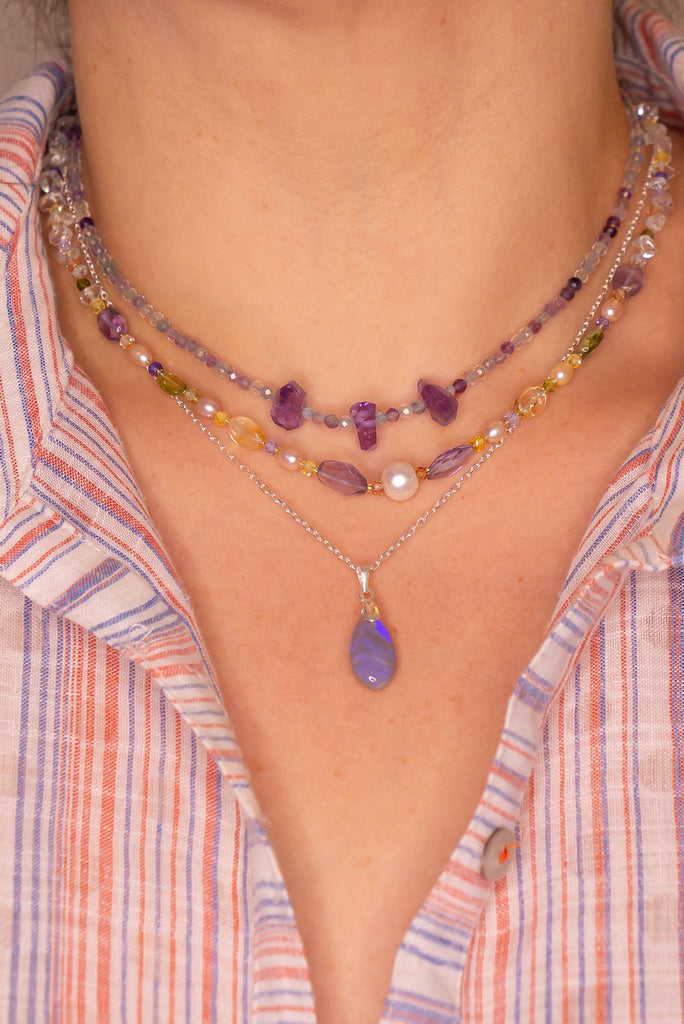 This opal pendant is as soft and pretty as a mist from the ocean with soft blue and mauve colours.