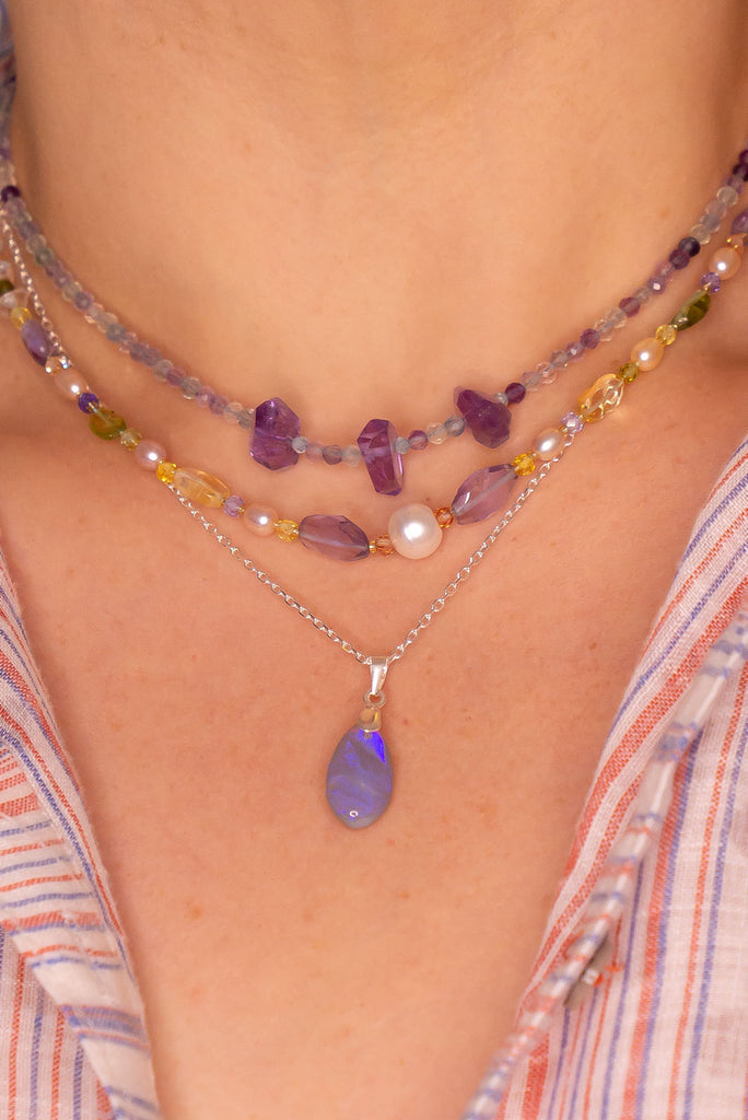 This opal pendant is as soft and pretty as a mist from the ocean with soft blue and mauve colours.