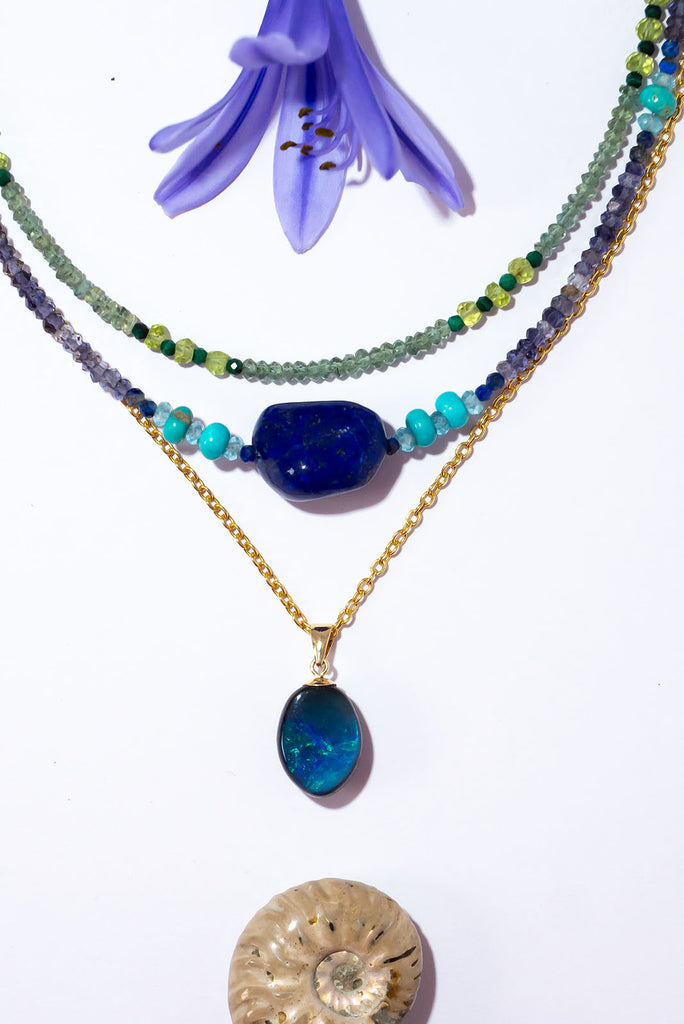 This exceptional and unique opal is both captivating in its design as well as its intense colours. Inspired by Nazare Reef this beautiful opal features swirls of blue, green and aqua.