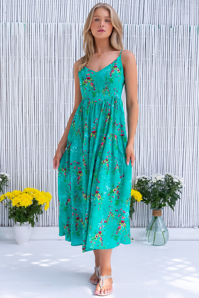 The Solana Green Seas Maxi Dress is a gorgeous sea green maxi dress with a botanical floral print and wash effect base. The dress features a v-neckline, fitted bust, back zipper, flow skirt and side pockets. Made from a woven blend of cotton and rayon.