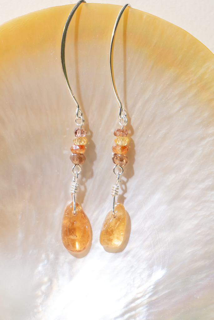 Luxurious Tourmaline Golden Droplet Earrings showcasing rhodolite garnet, sapphires, and golden tourmaline. Handcrafted in Brisbane, by Ocean Rose Jewels, adorned with sterling silver findings.