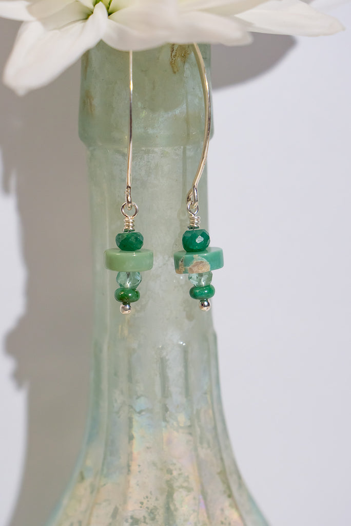 Dive into the playful Turquoise Green Seas Stack Earrings, where emerald, turquoise, prasiolite, and Sonoran gold form a lively stack. A vibrant ensemble capturing the spirit of green seas in motion.