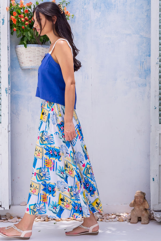 The Valentine Blue Postcards Maxi Skirt Is a beautiful white based maxi skirt with a blue and yellow postcard print. The skirt features an elastic waistband, half circle cut and is made from 100% rayon. 
