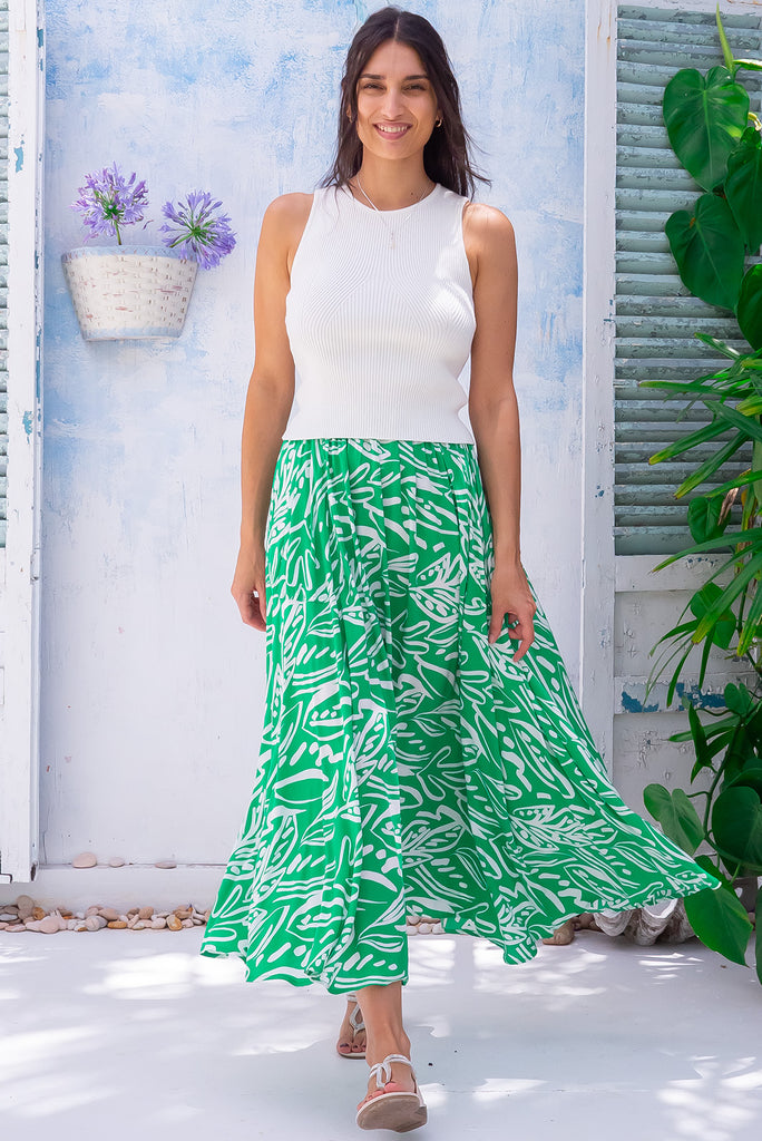 The Valentine Verde Maxi Skirt is a gorgeous, vibrant green based maxi skirt with a white, large island style print. The skirt features an elastic waistband, half circle cut and is made from 100% rayon. 