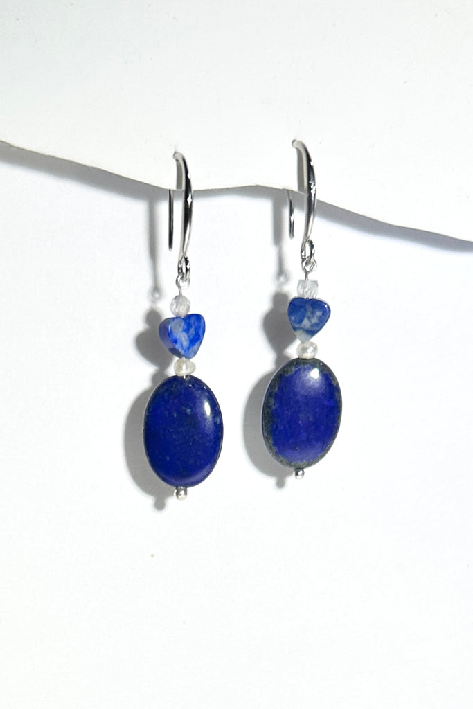Very chic and very modern, Lapis Lazuli earrings in oval rounded beads with a little heart bead and a tiny pearl. they have a casual and stylish vibe.
