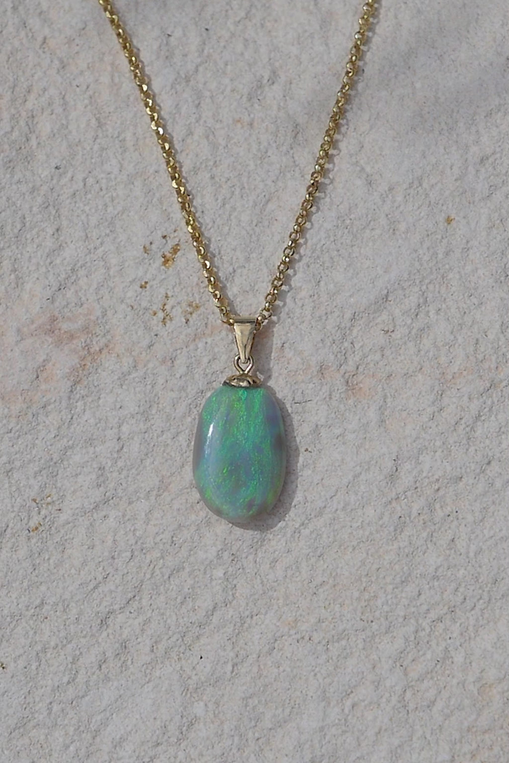 A soft wave of turquoise, teal and green washes down this gorgeous Australian opal pendant, the Opal of summer dreams.

4.22ct semi black Australian Opal with teal and green flash from Lightening Ridge Opal.