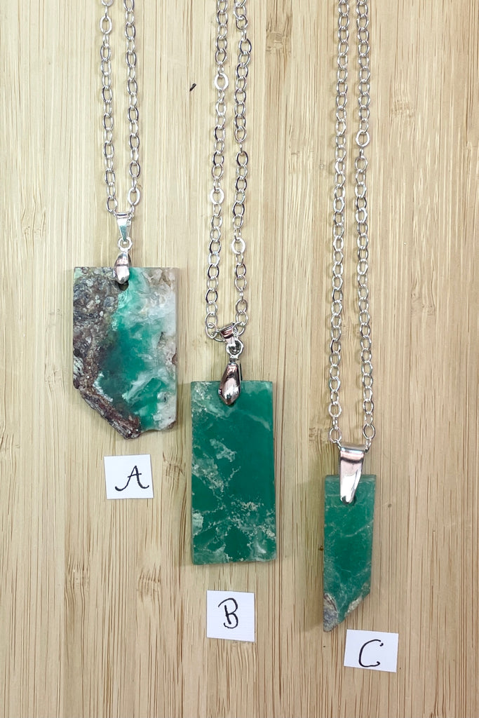 Chrysoprase in the raw, these rugged pendants were cut by a young local lapidarist to give a feel of the power of this gorgeous green stone.