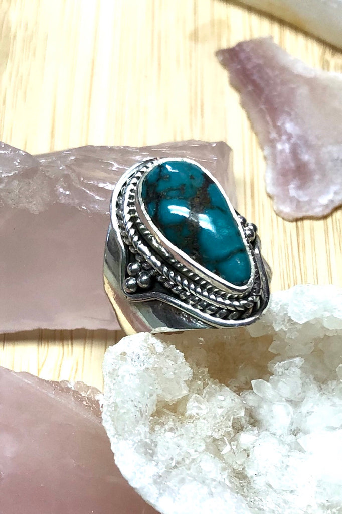 A heavy silver and dark turquoise ring featuring a natural Turquoise stone, in a 925 silver setting., perfect for boho lovers.