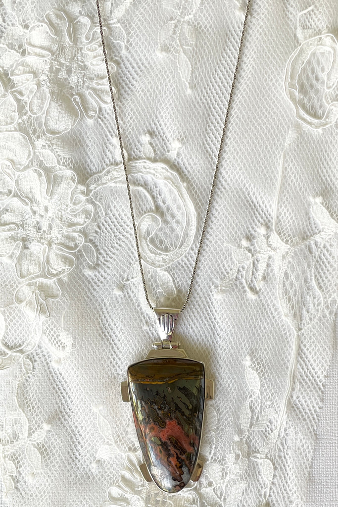 A powerful and intriguing Morrocan Jasper pendant reflecting the story of the ancient rock. A modernist setting in a unique design,