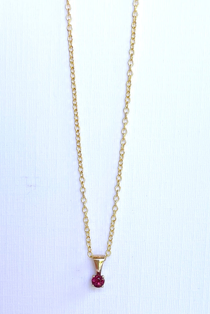 This adorable Luna pendant is made in 9ct gold, the stone is a lovely dark pink 3mm Tourmaline gemstone. A tiny delicate and sophisticated gemstone pendant.