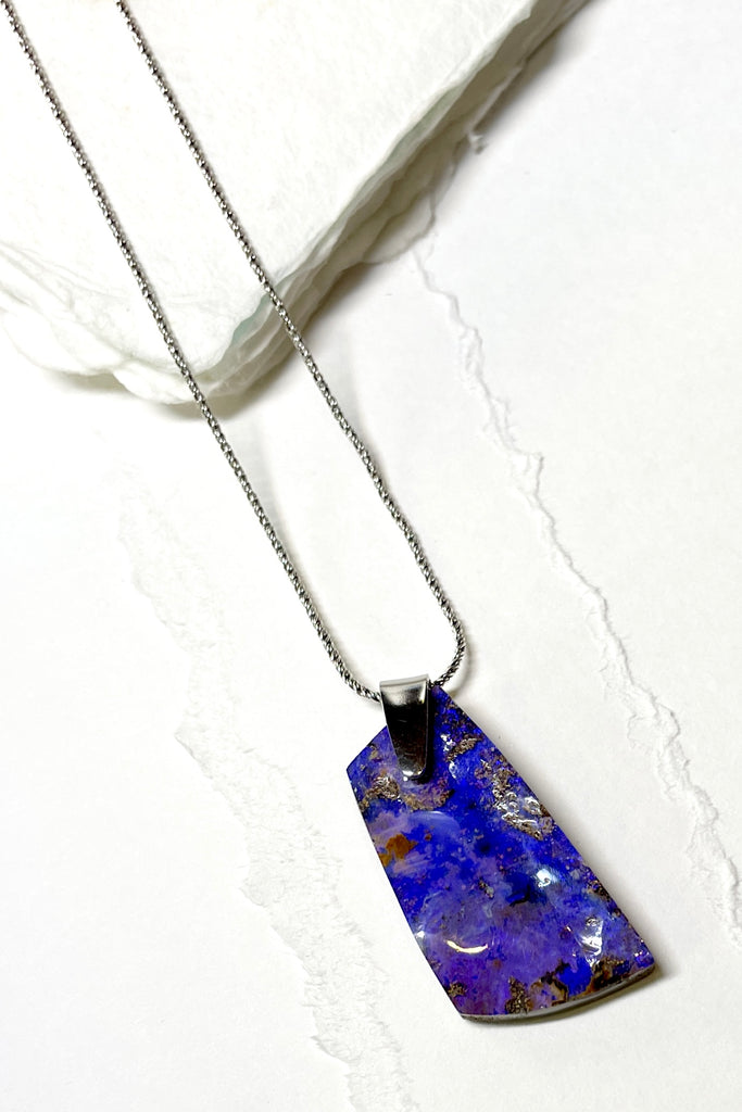 This is a one off piece, a hand cut opal, it shows the mark of the artist who cut and polished the stone. This genuine Australian Opal pendant stone was cut and polished in Australia. 
