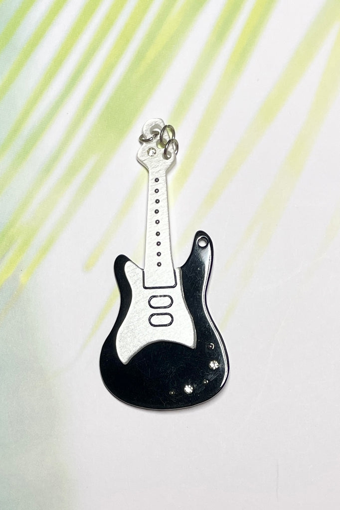 Black and white guitar brooch