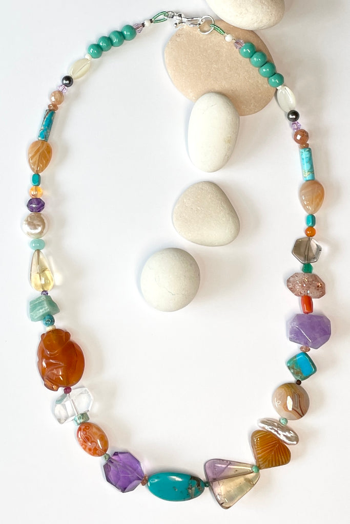 Beads are - Strawberry Quartz, Smokey Quartz, Pearl, Amazonite, Peruvian Agate, Amethyst, Carnelian, Agate, natural Sunstone, Ametrine, clear Rock Crystal, Green glass from South Africa, Natural genuine Turquoise - the centre turquoise bead is very old.