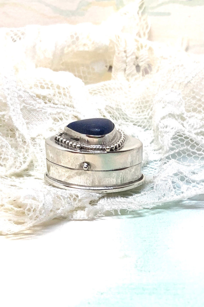 Echo Silver Box Lapis Lazuli inlaid Lid is a silver pill box inlaid with a triangular cabachon of Lapis Lazuli on the lid.