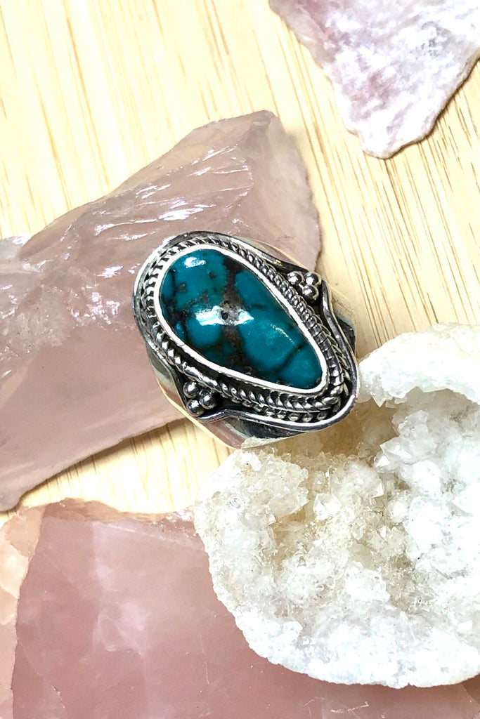 A heavy silver and dark turquoise ring featuring a natural Turquoise stone, in a 925 silver setting., perfect for boho lovers.