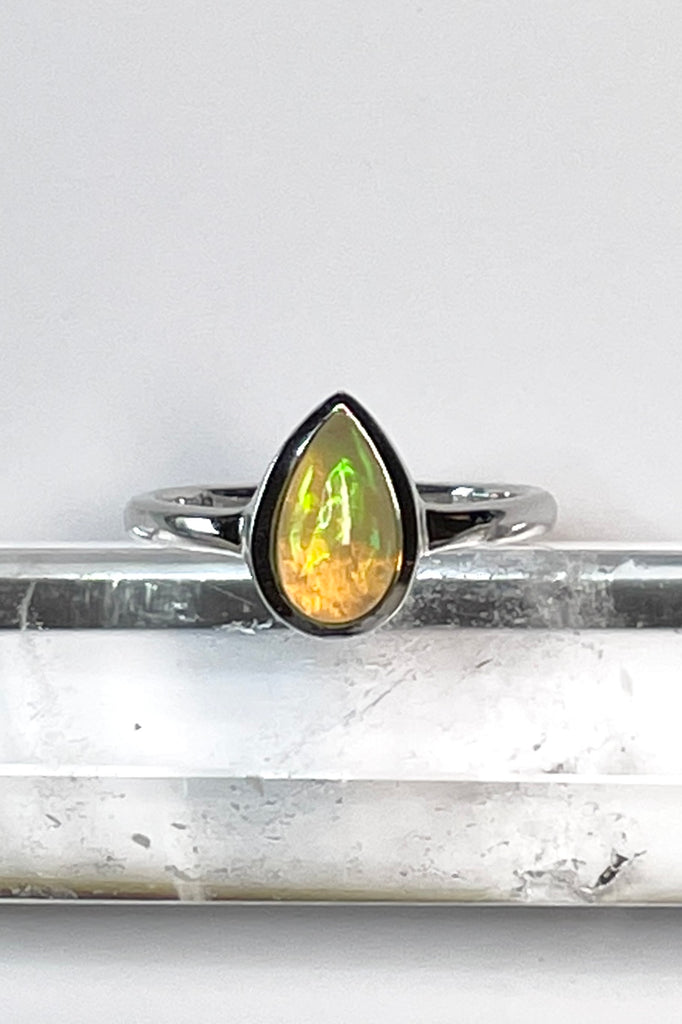 A pretty and luminescent opal gemstone, this darling and dainty little ring is simply perfection, the opal is from Ethopia in Africa, the flashes of colour are so pretty.