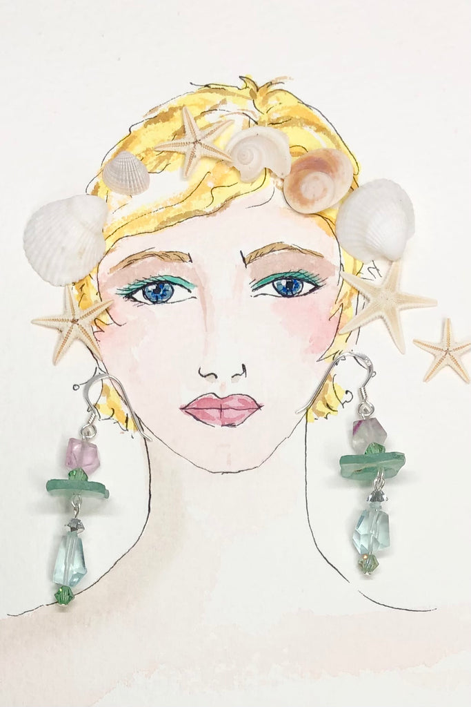 Hand cut antique glass set off with pale aqua Fluorite and swarovski crystal beads.