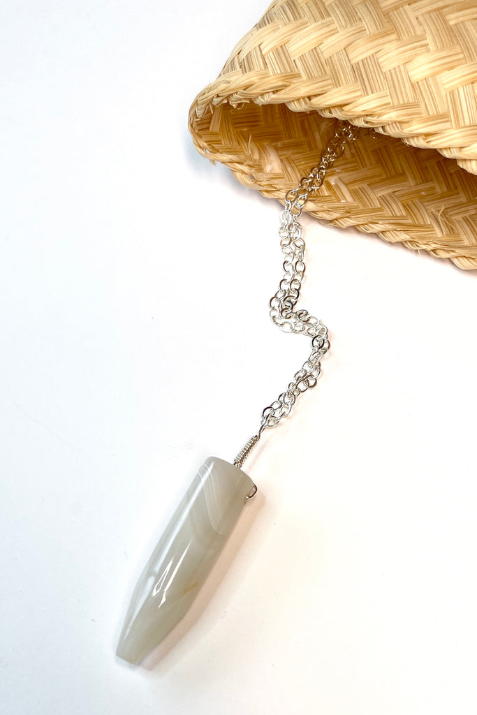 This pendant is a lovely piece of slightly transparent white Agate stone that has been cut and polished by ROAM Ladies Lapidary Collective in Sakaraha, Madagascar. 