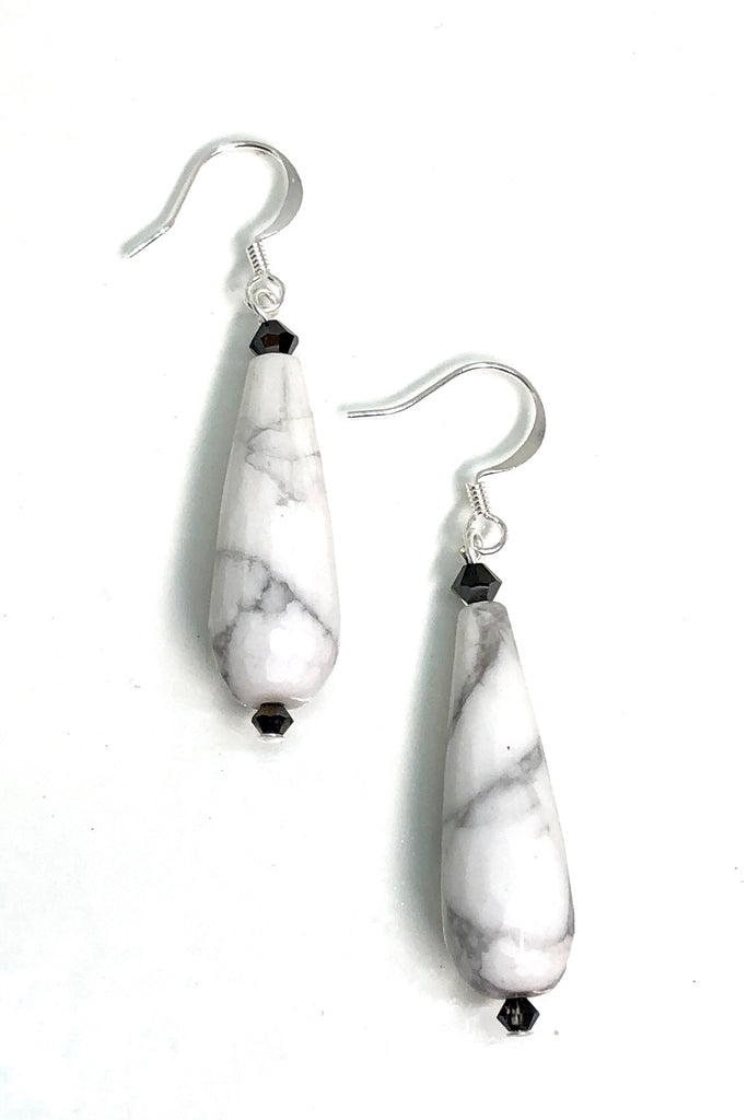 Earrings Rock Droplet White Marbled features approximately 6cm length, drop style earrings. 925 silver hook earrings and black teardrop shaped stone with a swarovski crystal bead on top.
