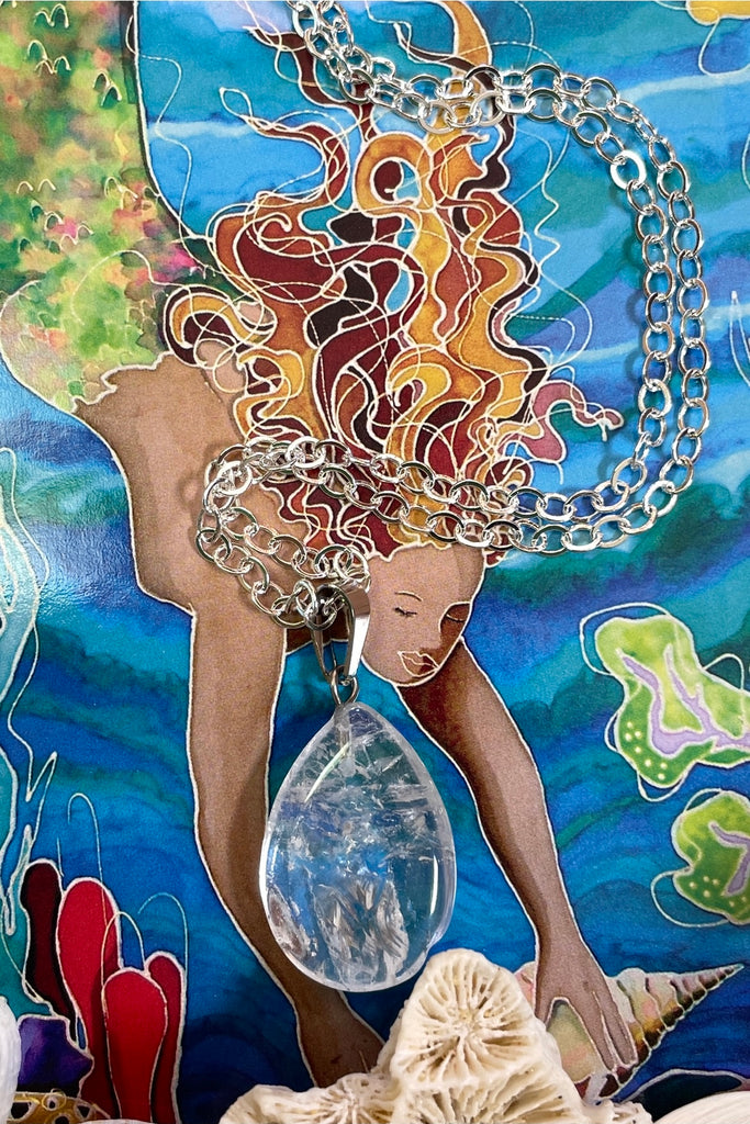 rock crystal droplet pendant is cut from natural stone.
