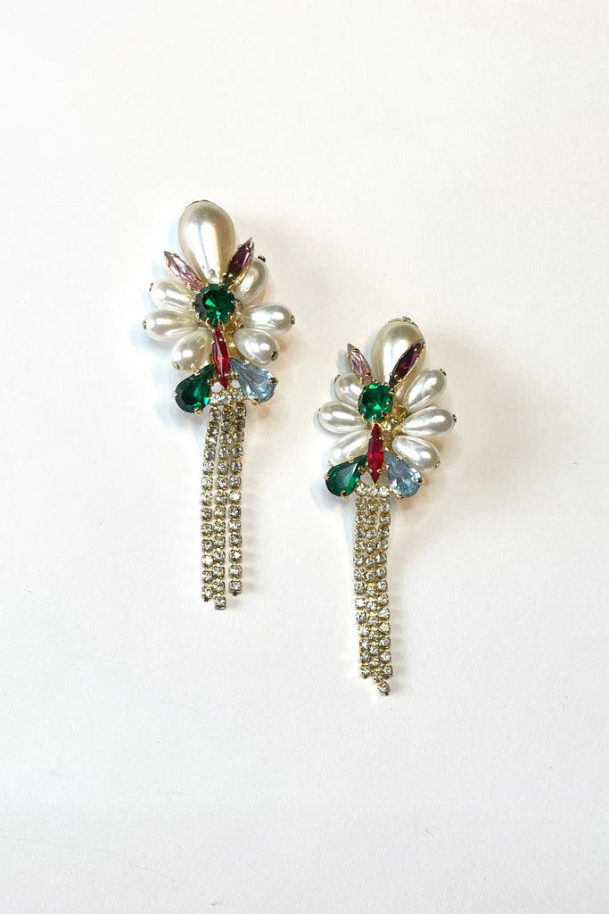 Fun clip on retro earrings featuring bright diamantes and faux pearls with diamante tassels