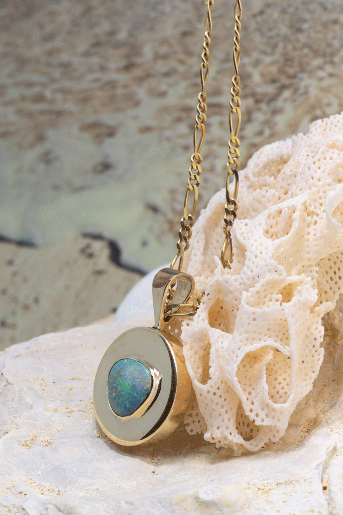 This Vintage pendant has a stunning solid Australian Opal centrepiece