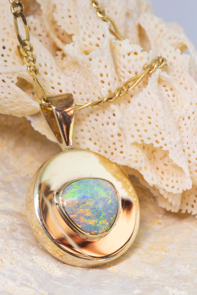 This Vintage pendant has a stunning solid Australian Opal centrepiece