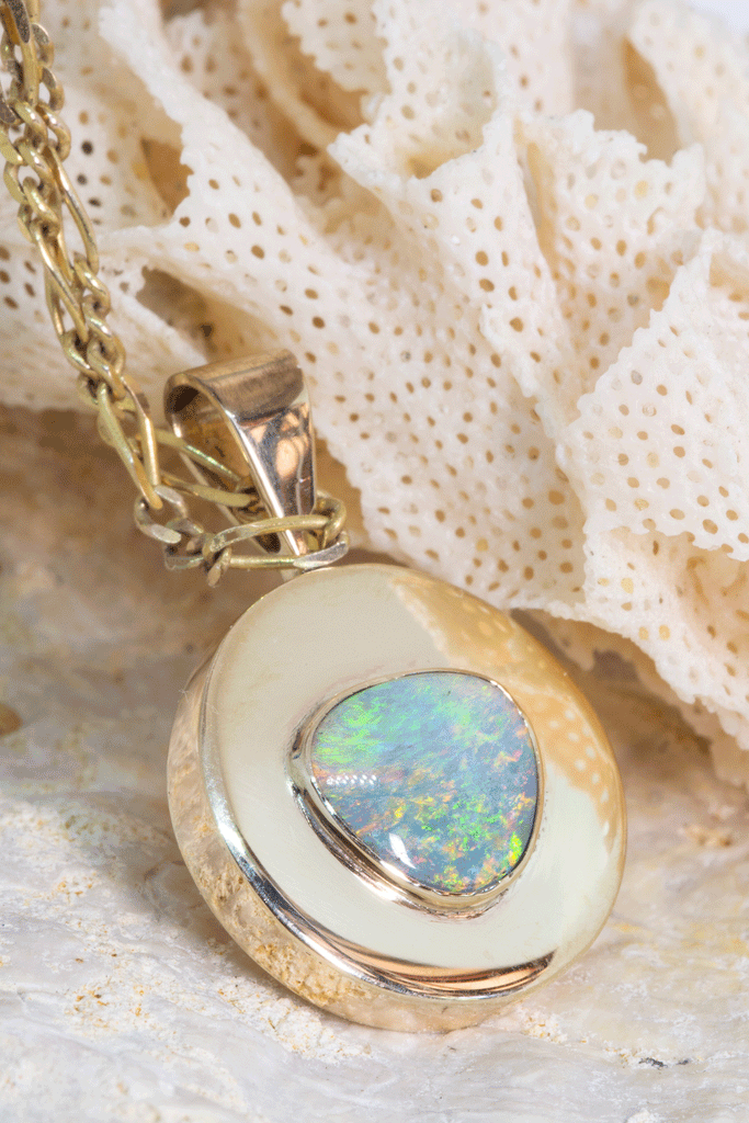 This Vintage pendant has a stunning solid Australian Opal centrepiece