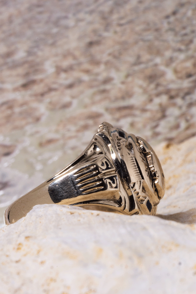 Vintage university ring with the date 1952, a raised crest of a flame centrepiece