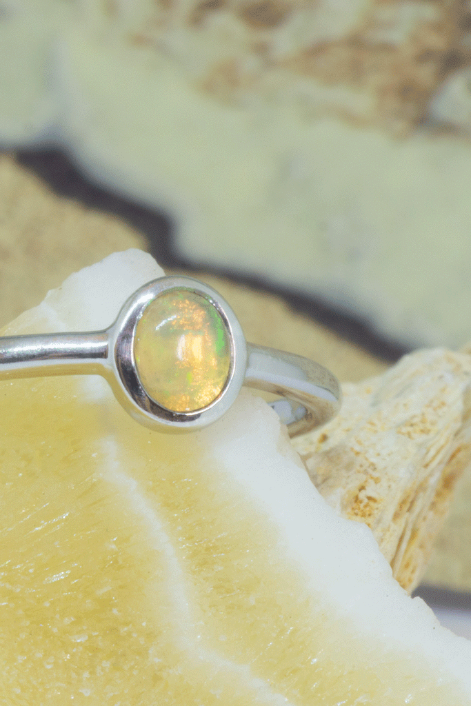 A beautiful luminescent tiny opal gemstone ring