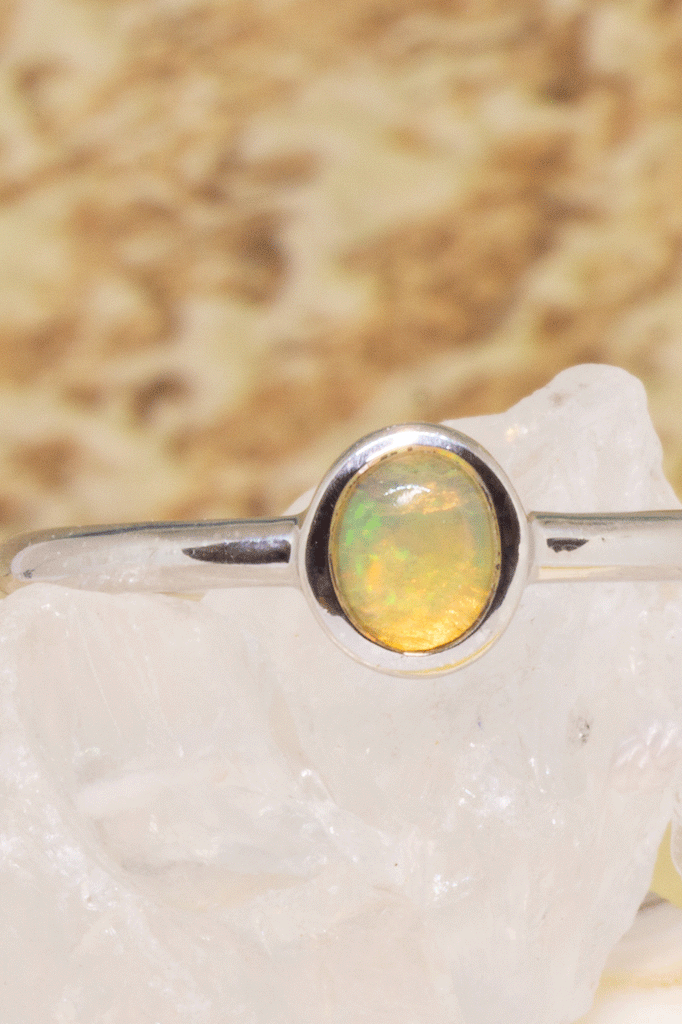 A beautiful luminescent tiny opal gemstone ring