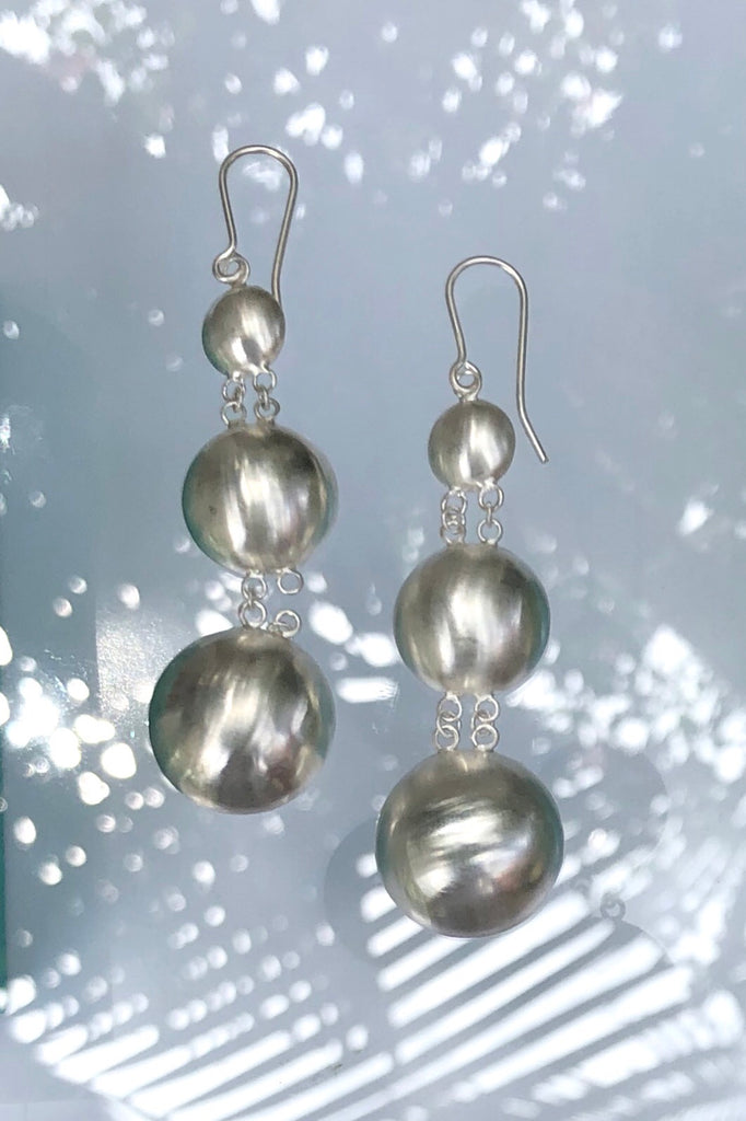 silver earrings in dome shape