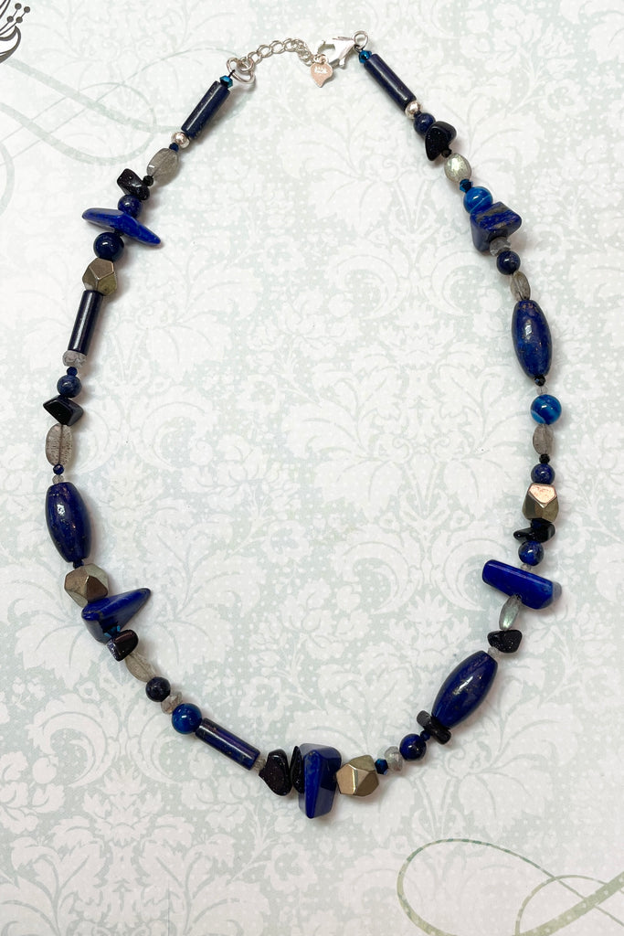 a sweet choker style hand made using an assortment of blue gemstones. These include Lapis Lazuli, Agate, Labradorite and natural Pyrite. 