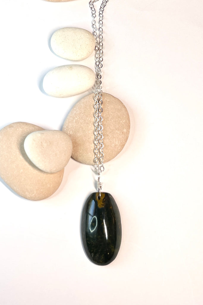 This pendant is a lovely piece of dark grey green Agate stone that has been skillfully cut into a pleasing oval shape then polished, by ROAM Ladies Lapidary Collective in Sakaraha, Madagascar. 