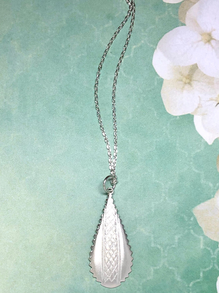 Silver pendant designed in African chic modern style.