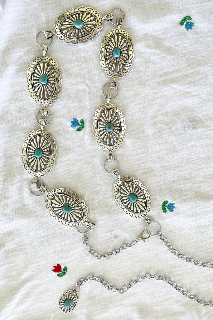 Santa Fe style Conch belt with Turquoise is sure to be one for the bohemian cowgirl