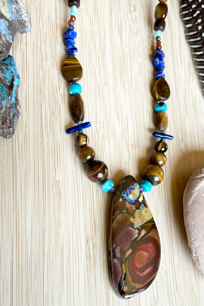 This necklace has been designed using natural Opal and many different semi precious gemstones
