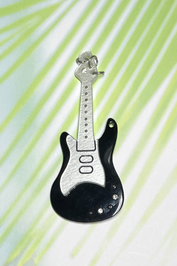 Black and white guitar brooch