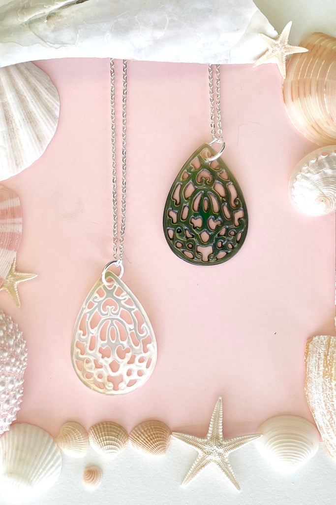 Pendant Cay Caribbean droplet is hand carved from a mother of pearl shell,