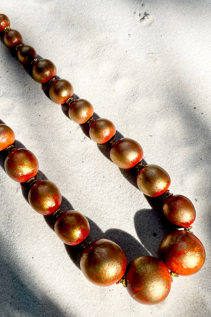  A Long necklace with hand painted beads in graduating sizes