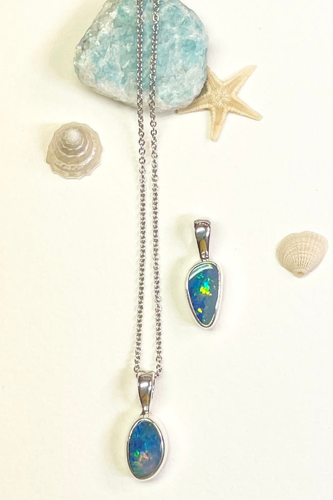 The Australian opal pendant is shaped into a small round oval shape, very dainty.