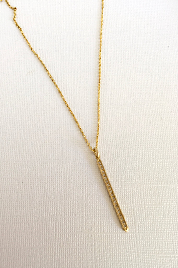 Made in gold vermeil and tiny sparkling white topaz gemstones, the finish is quiet and naturalistic, the surface is matte. 