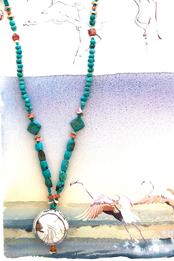 The centre piece is an inlaid Naga conch shell bead from Tibet. The beads are all genuine natural Turquoise, very irregular and some are very old.
