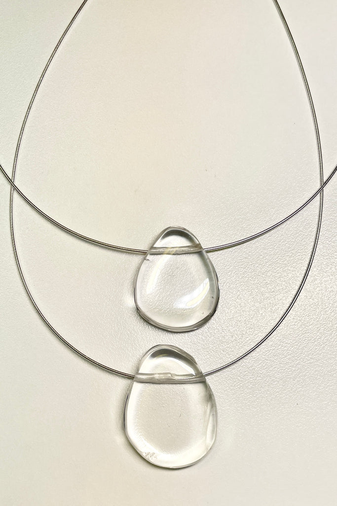 The Pendant is a gorgeous clear rock crystal, it hangs from a 925 silver Omega chain.