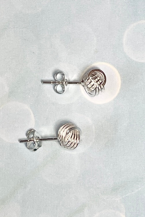Silver stud earrings formed as a tiny rope knot in 925 Silver, a perfect lightweight everyday earring with a hint of sophistication