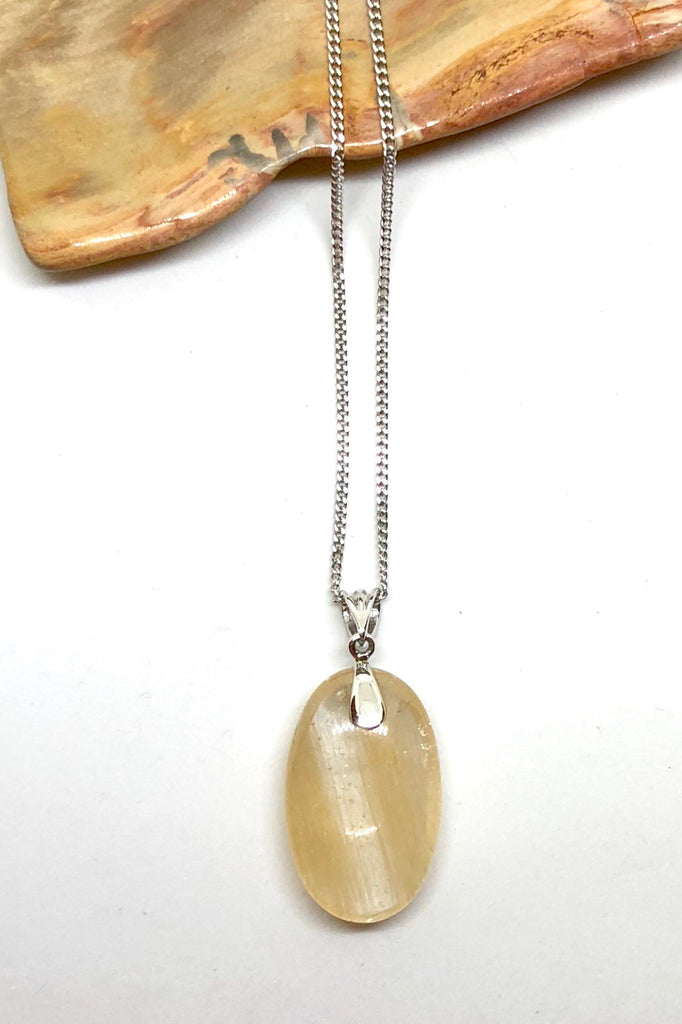 The Pendant of Golden Rutilated Quartz on a Silver Chain 1  will bring through intense energy featuring 3.5 cm length and coming on a silver chain.