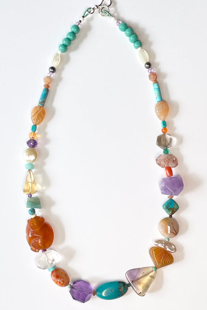 Beads are - Strawberry Quartz, Smokey Quartz, Pearl, Amazonite, Peruvian Agate, Amethyst, Carnelian, Agate, natural Sunstone, Ametrine, clear Rock Crystal, Green glass from South Africa, Natural genuine Turquoise - the centre turquoise bead is very old.