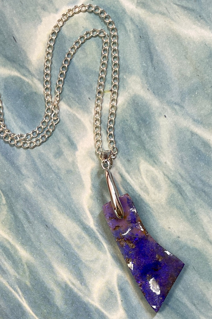 This is a one off piece, a hand cut opal, it shows the mark of the artist who cut and polished the stone. This genuine Australian Opal pendant stone was cut and polished in Australia. 